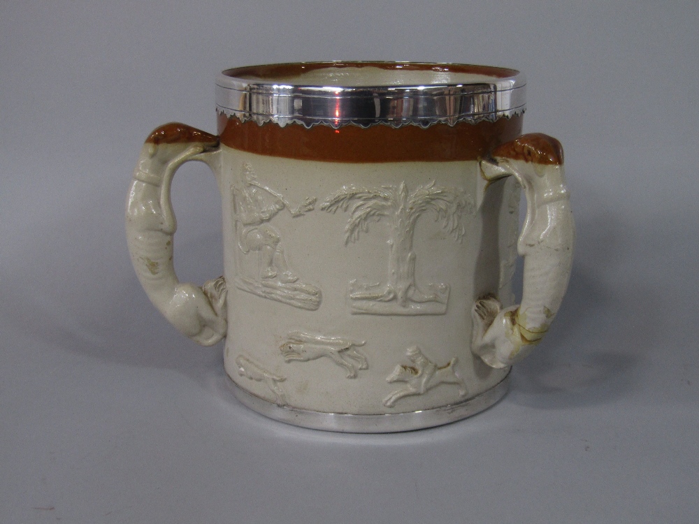 A substantial 19th century relief moulded stoneware tyg with applied sprig decoration of hounds,