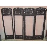 A small Japanese four fold screen with decorative carved framework (AF) lacks panels, together