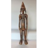 Tribal interest - Carved wooden figure of a tribeswoman possibly a fertility figure, 55 cm high