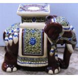A glazed ceramic conservatory or garden seat in the form of a elephant in ceremonial dress