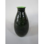 A Doulton Lambeth faience vase with dark green Titanium glazed finish and with impressed mark to