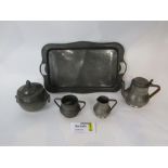 Three piece planished pewter baluster tea service with twin handled tray and further pewter lidded