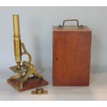 Cased Henry Crouch of London brass microscope with various spare lenses, etc