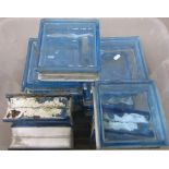 Eleven moulded blue tinted glass bricks, 9 inches square