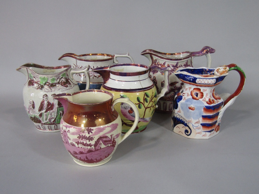 A collection of six early 19th century jugs in various designs including ironstone example with