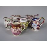 A collection of six early 19th century jugs in various designs including ironstone example with