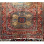 Good quality full pile Afghan rug, decorated with various medallions upon a pale ground, 180 x
