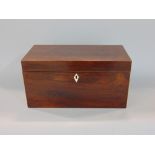 Regency rosewood and boxwood inlaid tea caddy, the hinged lid enclosing an interior fitted with