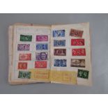 A Lincoln stamp album containing a mixed collection of worldwide stamps, early to mid 20th century