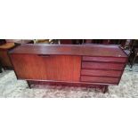 A Richard Hornby Afromosia sideboard, enclosed by a pair of doors and tower of four long graduated