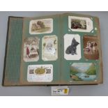 Two albums containing a quantity of mixed postcards including topographical, romantic, greetings,