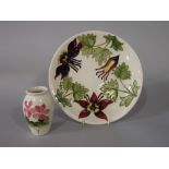 A cream ground Moorcroft plate in the Columbine pattern with impressed and painted marks to base,