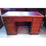 A Georgian style mahogany kneehole, twin pedestal writing desk, with canted corners, inset leather