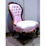 A Victorian drawing room chair, with light pink floral patterned upholstered seat, buttoned back and