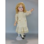 Early 20th century bisque headed doll by Armand Marseille marked 1894 AM5DEP, with long hair and