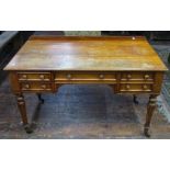 A Victorian satin walnut writing desk with five frieze drawers raised on fluted supports, 122 cm