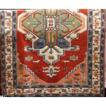 Good Turkish carpet, with colourful medallion decoration on a red ground, 290 x 185cm