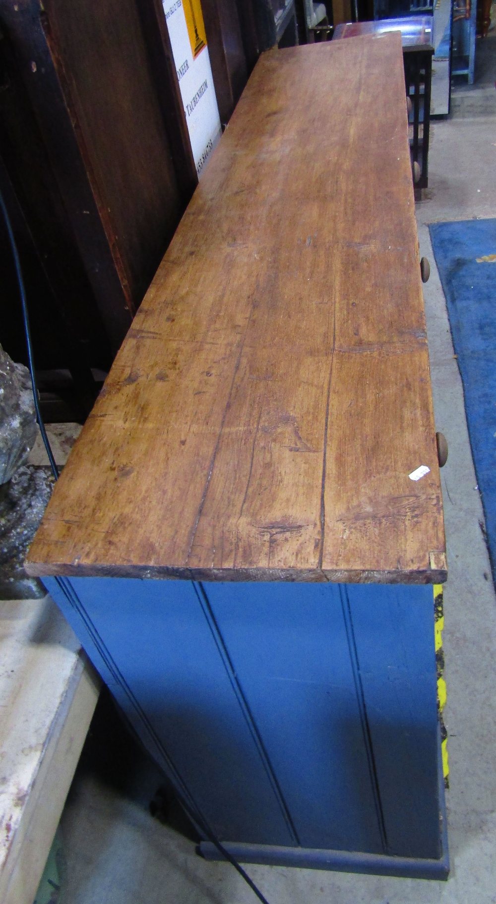 A rustic reclaimed pine kitchen dresser base, enclosed by four rectangular twin panelled doors, - Image 2 of 5