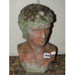 A small weathered terracotta head and shoulder bust in the form of a classical male character,