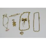 Collection of 9ct jewellery comprising a bow brooch, cultured pearl bar brooch, teddy bear charm and