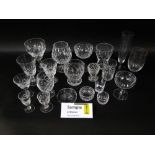 A large collection of various star cut drinking glasses to include wines, champagnes, various