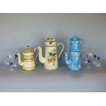 Three various French coffee pots with various painted decoration, together with a set of ten wine
