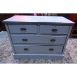 An Edwardian walnut bedroom chest of two short over two long drawers, with cast brass handles and