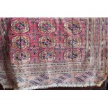 A good quality Bokhara rug with three line geometric decoration upon a pink ground, 215 x 165cm