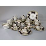 A quantity of early 20th century Coalport teawares with floral decoration on a blue and gilt ground,
