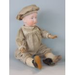 Early 20th century bisque headed baby doll by Heubach with composition body, articulating limbs,