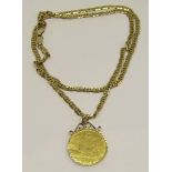 9ct flat curb link necklace hung with a Swiss yellow metal 'OBWALDNER KANT SCHUTZENFEST, KERNS 1983'