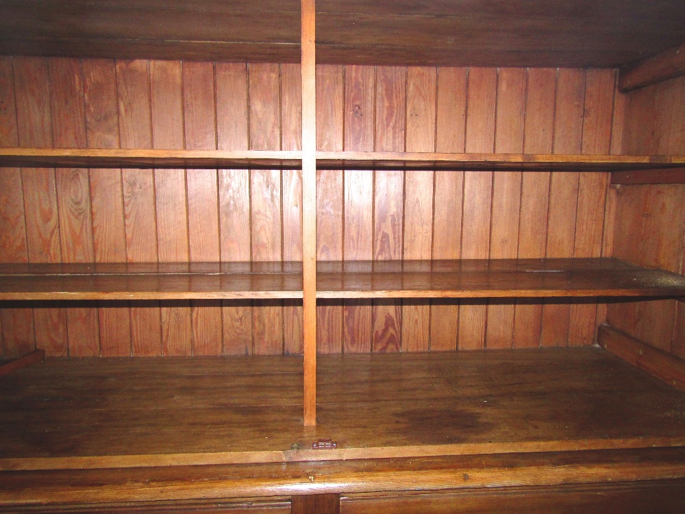 A substantial pitch pine dresser, the upper section enclosed by a pair of rectangular glazed - Image 2 of 2