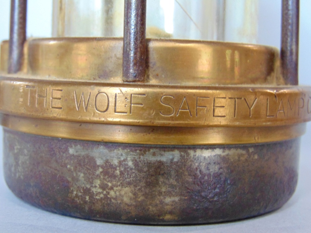 Two antique steel and brass miners lamps, the largest by The Wolf Safety Lamp Co, Sheffield, the - Image 2 of 2