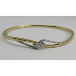 9ct bi-colour hinged bangle set with three diamonds, 10g