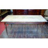 A 19th century elm farmhouse kitchen table, the plank top raised on four turned tapering bobbin