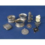 A collection of bijouterie silver to include three napkin rings, interesting Masonic type pendant,