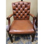 A good quality Georgian style open armchair, the mahogany framework supporting a leather upholstered