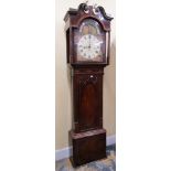 A Regency period mahogany longcase clock, the door with lancet shaped outline flanked by reeded