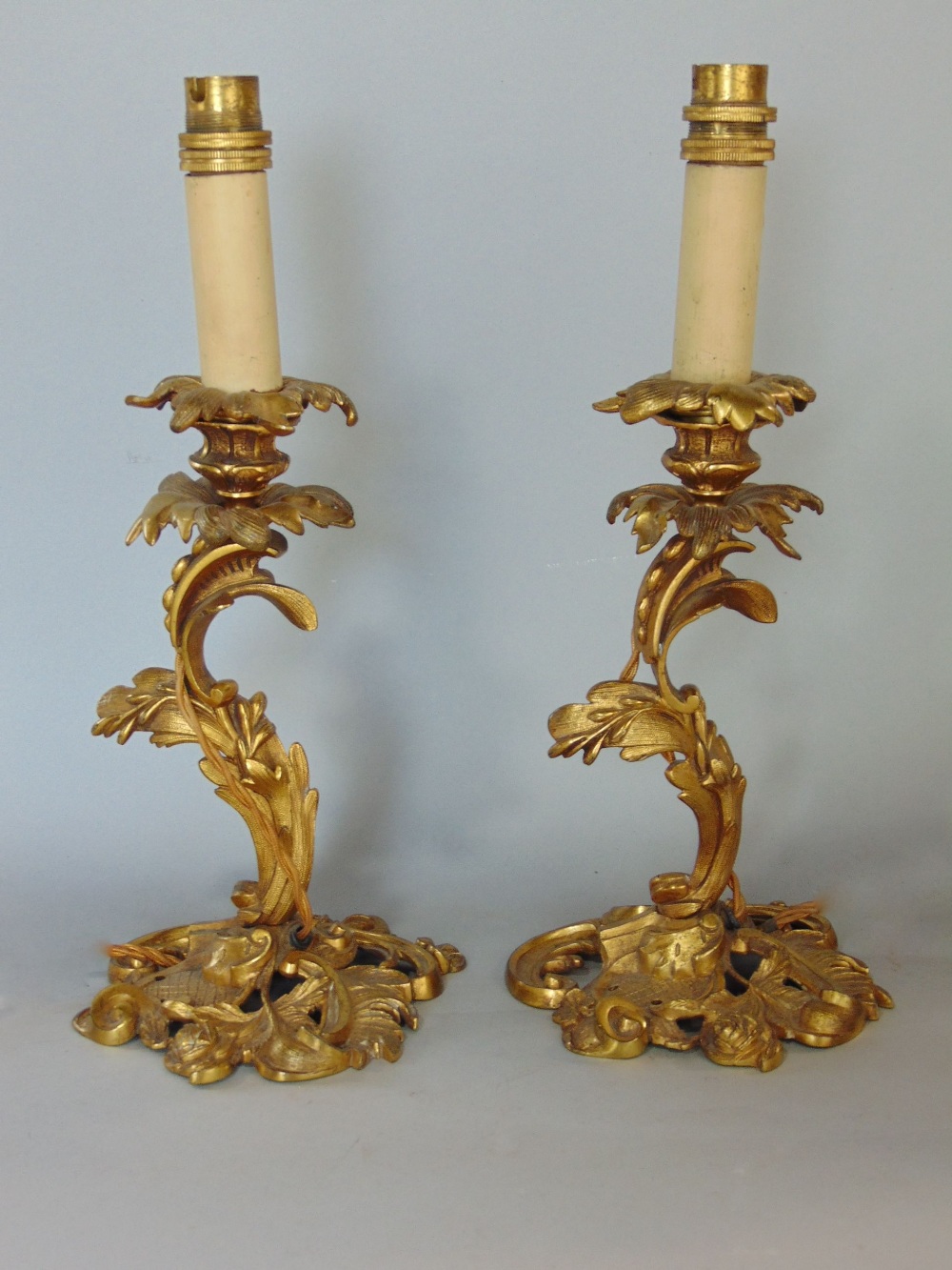 Pair of French ormolu candlestick table lamps, in the form of scrolled acanthus, 35cm high (2)