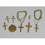 Collection of 9ct jewellery comprising two cross pendant necklaces, five further cross pendants