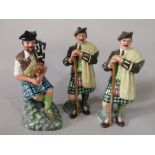 A Royal Doulton figure of The Piper HN2907 together with two Royal Doulton figures of Laird
