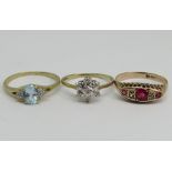 Three 9ct diamond set rings; a blue topaz cluster example, an antique ruby example (one diamond