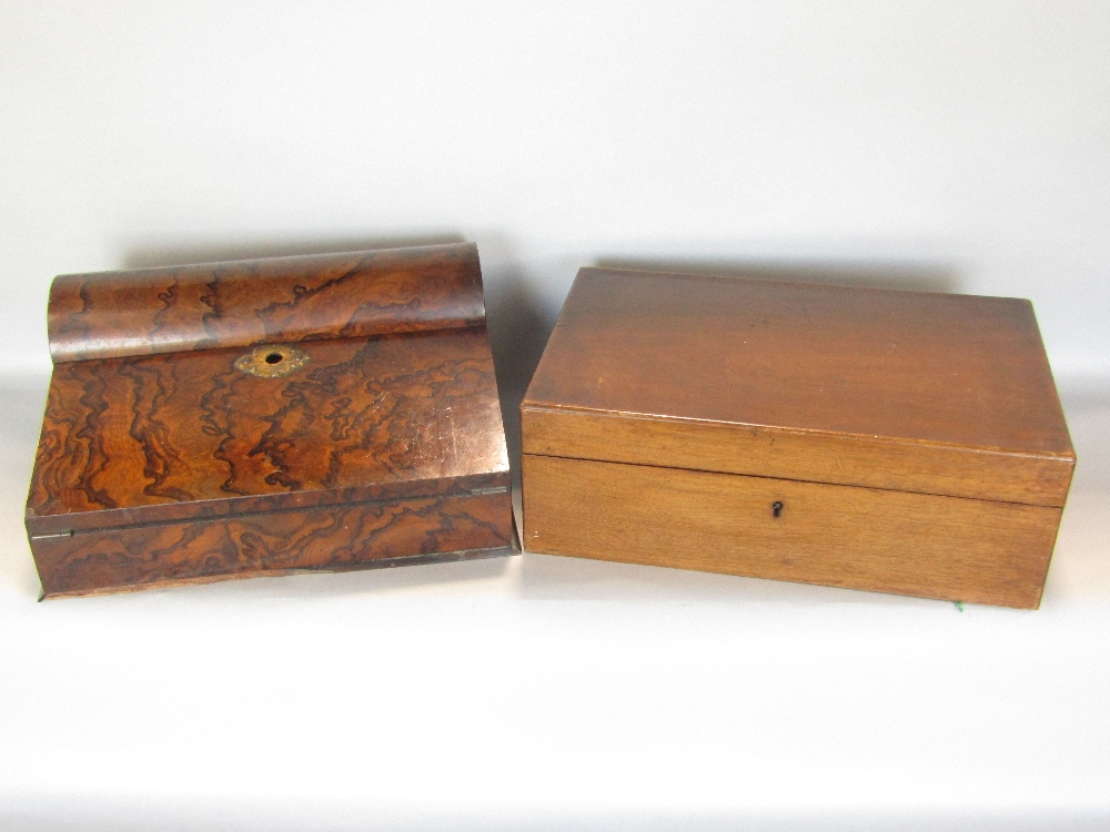 A good quality burr walnut writing slope, with domed hinged top enclosing two ceramic inkwells and