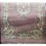 Chinese wool rug, with typical floral design upon a pink ground, 180 x 120cm