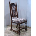 A set of six oak high back dining chairs, with upholstered seats and back pads, within carved and