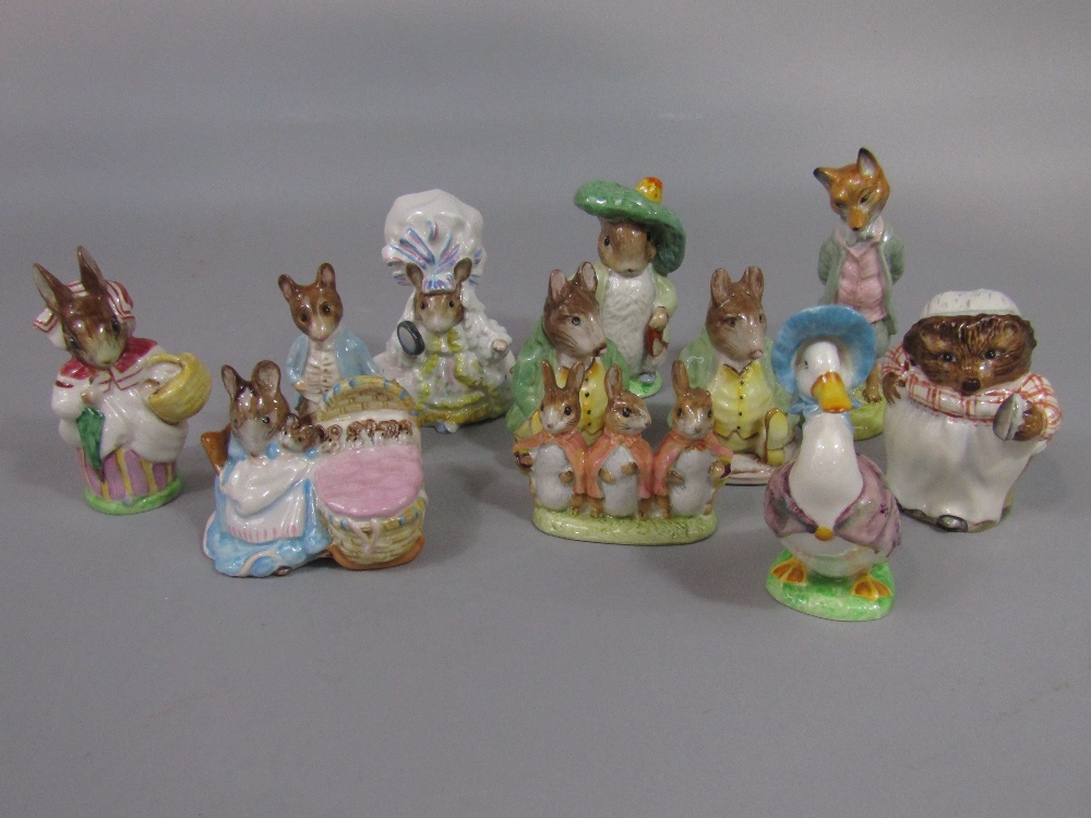 A collection of Beswick Beatrix Potter figures including two Samuel Whiskers with brown back stamps,