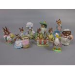 A collection of Beswick Beatrix Potter figures including two Samuel Whiskers with brown back stamps,