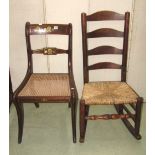 A Regency mahogany bar back dining chair with brass inlaid detail, cane panelled seat and sabre