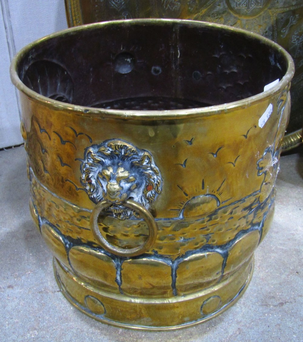 An arts and crafts style polished brass coal bucket, with lions mask and ring handles and galleon - Image 2 of 2