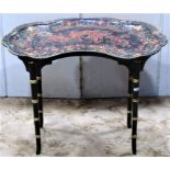 A low occasional table with black lacquered kidney shaped removable tray top with crane stork detail